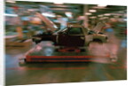 Partially Assembled Car Moving Through Work Station by Anonymous