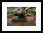 Partially Assembled Car Moving Through Work Station by Anonymous