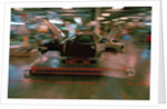 Partially Assembled Car Moving Through Work Station by Anonymous