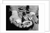 Man Holding Silkworms by Anonymous