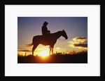 Cowboy Silhouetted at Sunset by Anonymous