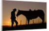 Cowboy Standing with His Horse by Anonymous