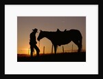 Cowboy Standing with His Horse by Anonymous