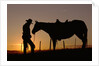 Cowboy Standing with His Horse by Anonymous