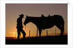 Cowboy Standing with His Horse by Anonymous
