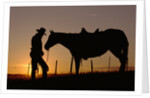 Cowboy Standing with His Horse by Anonymous
