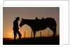 Cowboy Standing with His Horse by Anonymous