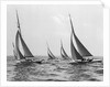 Six Meter Sailboats Leaning in Race by Anonymous