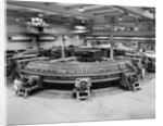 Technicians Near Circular Electronic Device by Anonymous