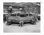 Technicians Near Circular Electronic Device by Anonymous
