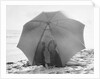 Couple on Beach Under Umbrella by Anonymous