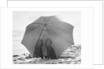 Couple on Beach Under Umbrella by Anonymous