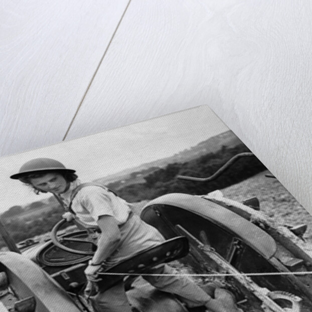 A Land Girl ploughing a field by Associated Newspapers