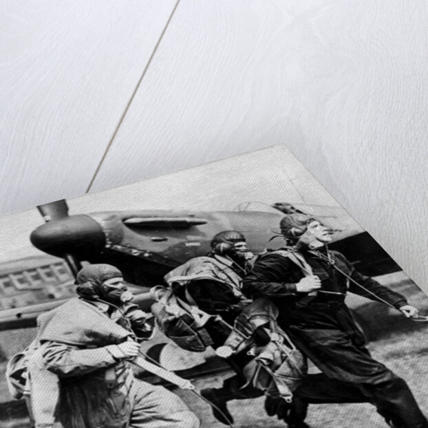 Fighter pilots run to their planes by Associated Newspapers