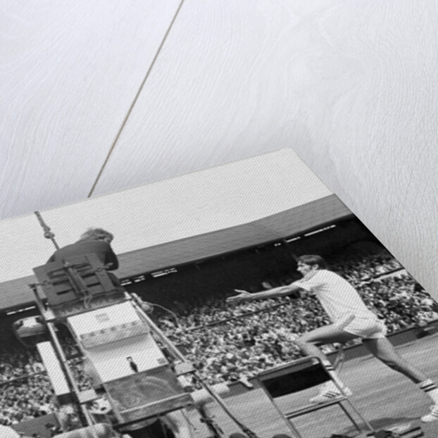 Ilie Nastase argues with the umpire by Associated Newspapers