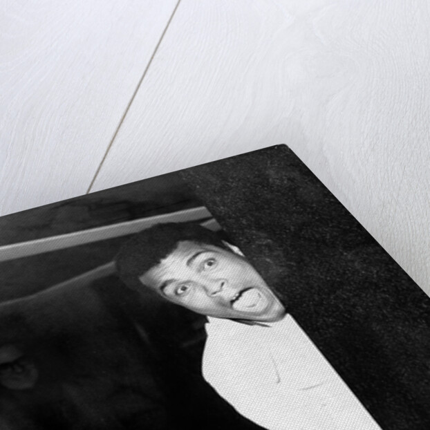 Muhammad Ali larking about at Heathrow by Associated Newspapers