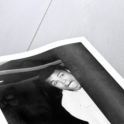 Muhammad Ali larking about at Heathrow by Associated Newspapers