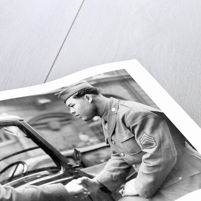 Boxer Joe Louis in uniform by Associated Newspapers