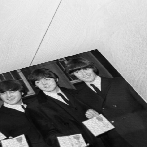 The Beatles show their MBEs by Associated Newspapers