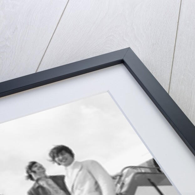 The Beatles on the steps of a plane by Associated Newspapers