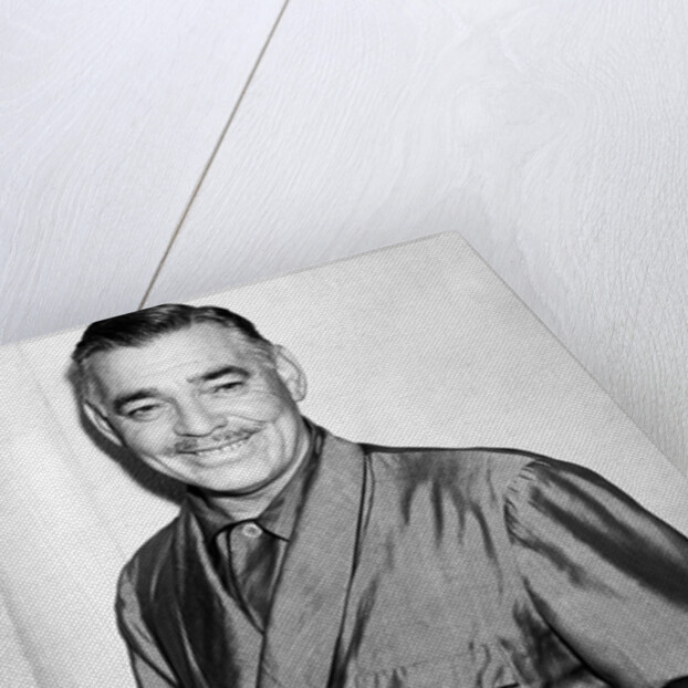 Clark Gable in a dressing gown by Associated Newspapers