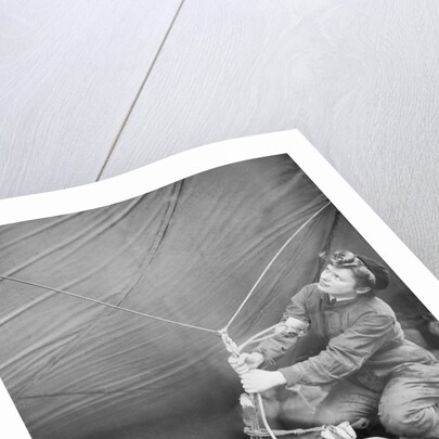 WAAF checking barrage balloon by Associated Newspapers