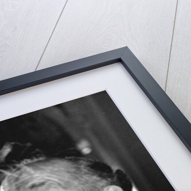 Boxer Henry Cooper smoking a pipe by Associated Newspapers