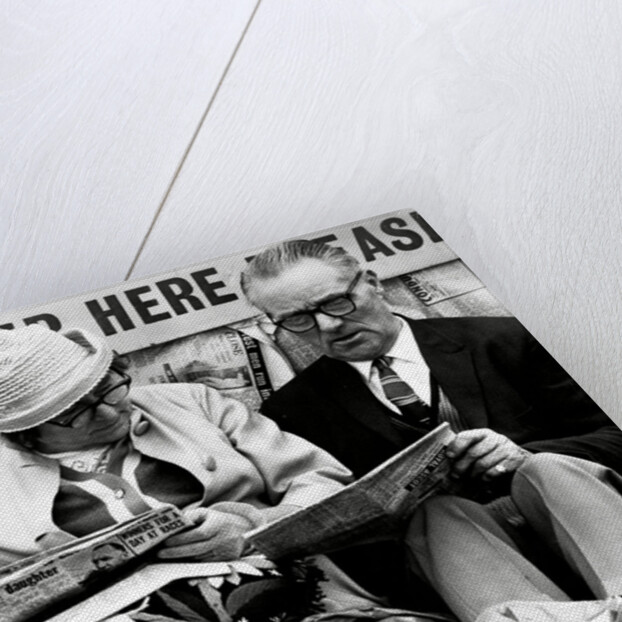 Racegoers relaxing by Associated Newspapers
