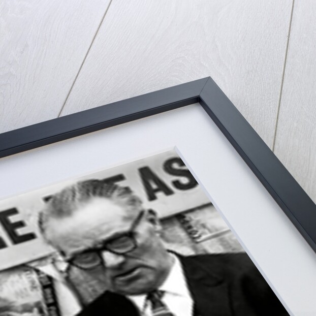 Racegoers relaxing by Associated Newspapers