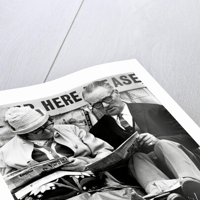 Racegoers relaxing by Associated Newspapers