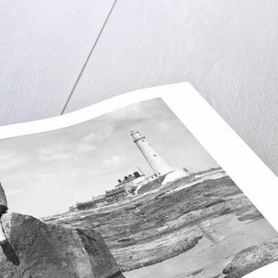 On the beach by the lighthouse at Whitley Bay by Associated Newspapers