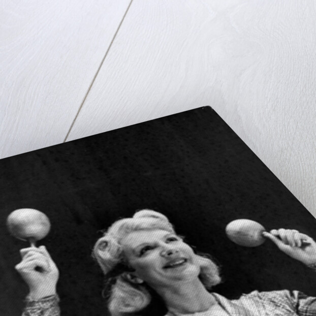 Dance band leader with maracas by Associated Newspapers