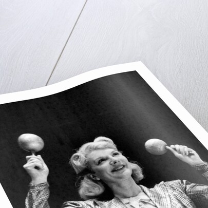 Dance band leader with maracas by Associated Newspapers