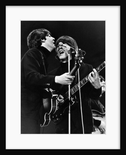 Paul McCartney and George Harrison on stage by Associated Newspapers