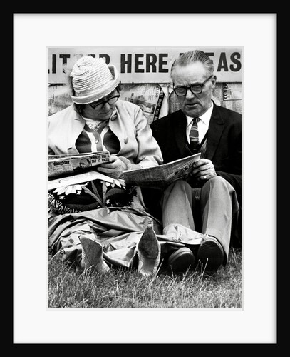 Racegoers relaxing by Associated Newspapers