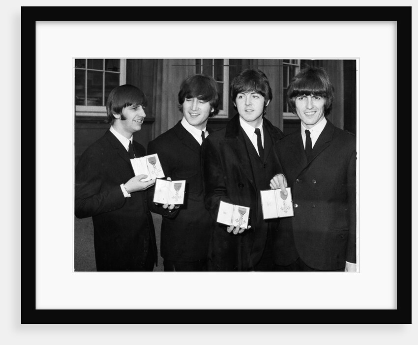 The Beatles show their MBEs by Associated Newspapers