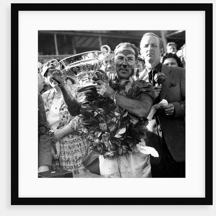 Sir Stirling Moss, racing driver after winning his first British Grand Prix in 1955 by Associated Newspapers