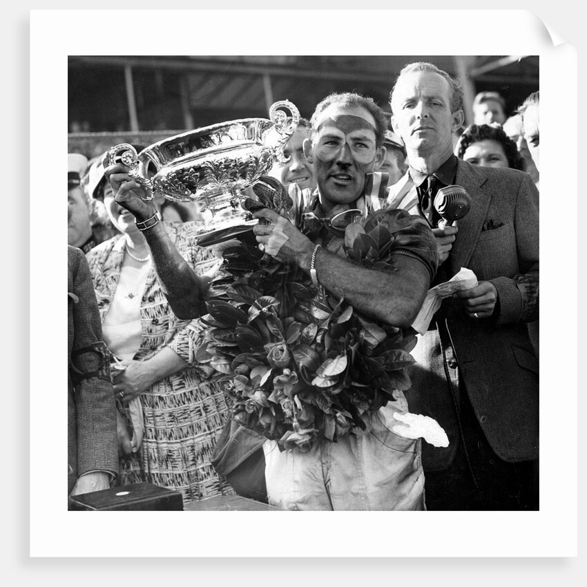 Sir Stirling Moss, racing driver after winning his first British Grand Prix in 1955 by Associated Newspapers