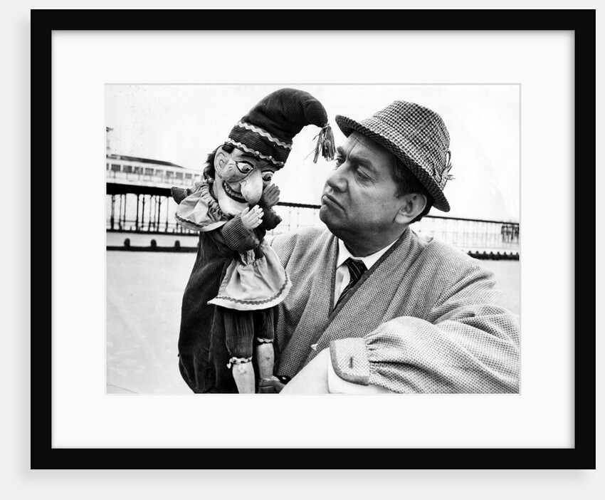 Tony Hancock with a Punch puppet by Associated Newspapers