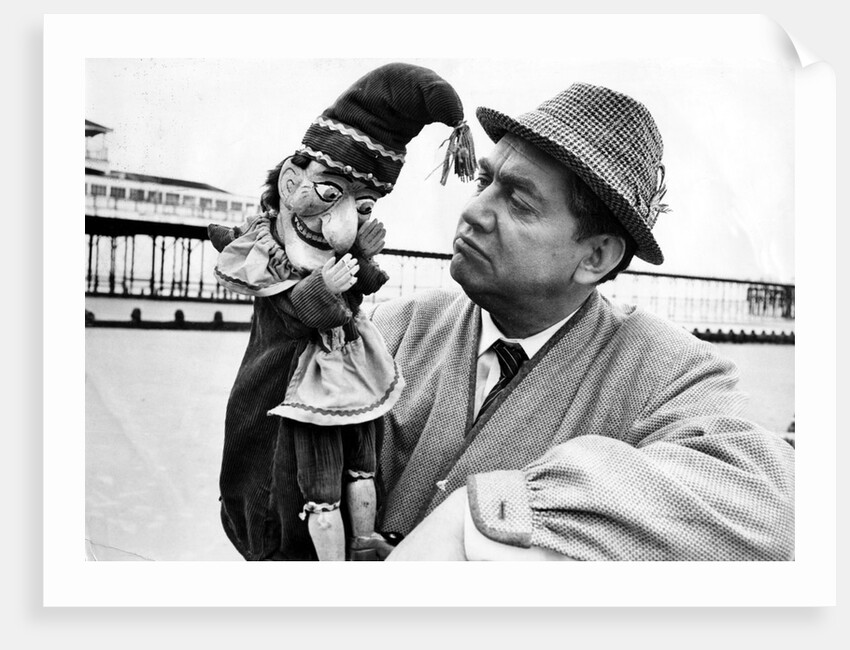 Tony Hancock with a Punch puppet by Associated Newspapers