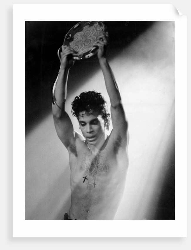 Prince with tambourine by Associated Newspapers