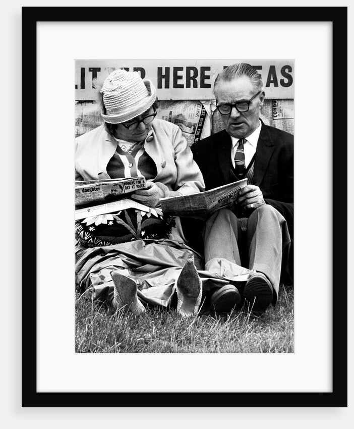 Racegoers relaxing by Associated Newspapers
