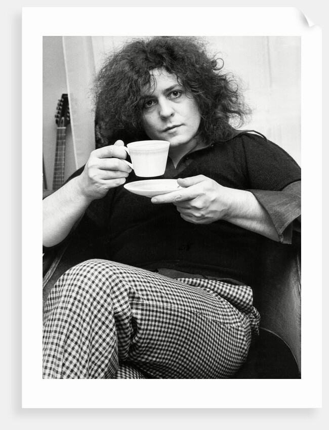 Marc Bolan with a cup of tea by Associated Newspapers
