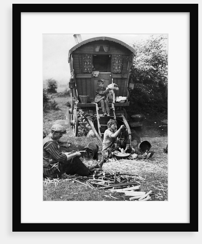 A Gypsy family with their caravan by Associated Newspapers