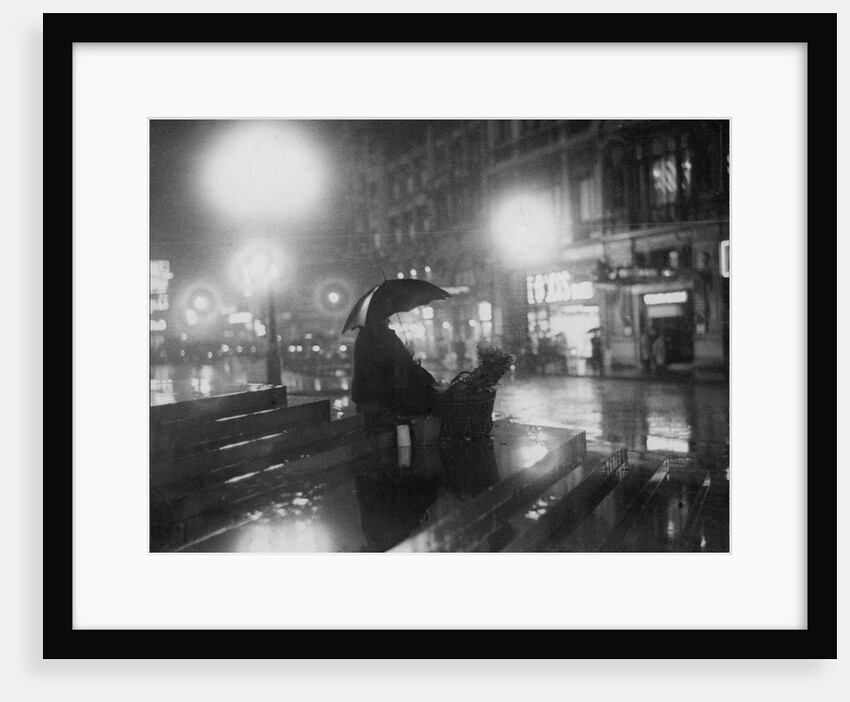 Flower Seller in the rain by Associated Newspapers