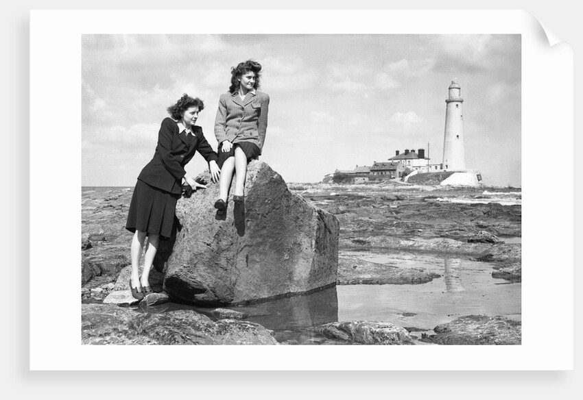 On the beach by the lighthouse at Whitley Bay by Associated Newspapers