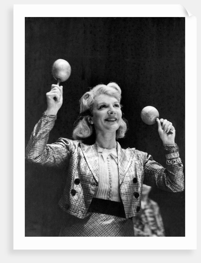 Dance band leader with maracas by Associated Newspapers