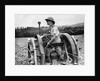 A Land Girl ploughing a field by Associated Newspapers