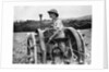 A Land Girl ploughing a field by Associated Newspapers
