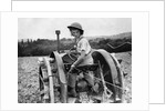 A Land Girl ploughing a field by Associated Newspapers